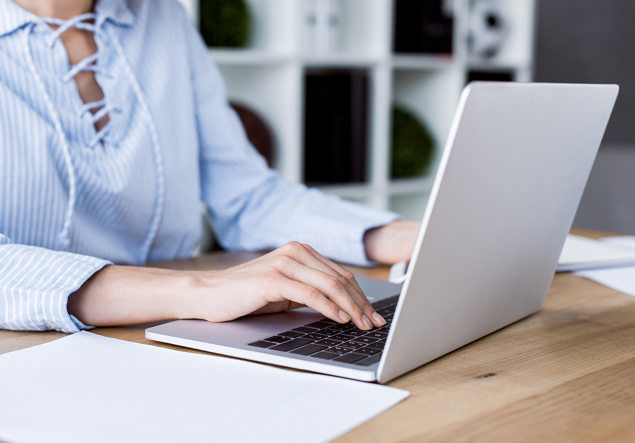 A woman looks up Defy Medical's Health Articles and Resources on her laptop.