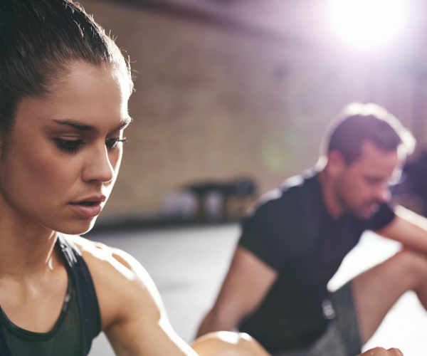 Healthy man and woman at the gym