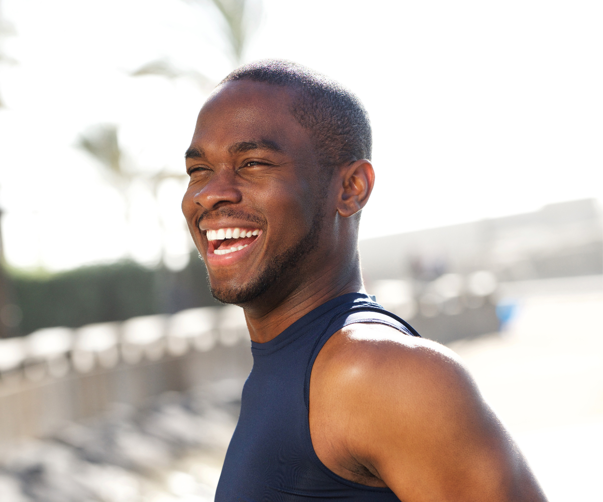 A man smiles outdoors as he experiences when TRT starts working