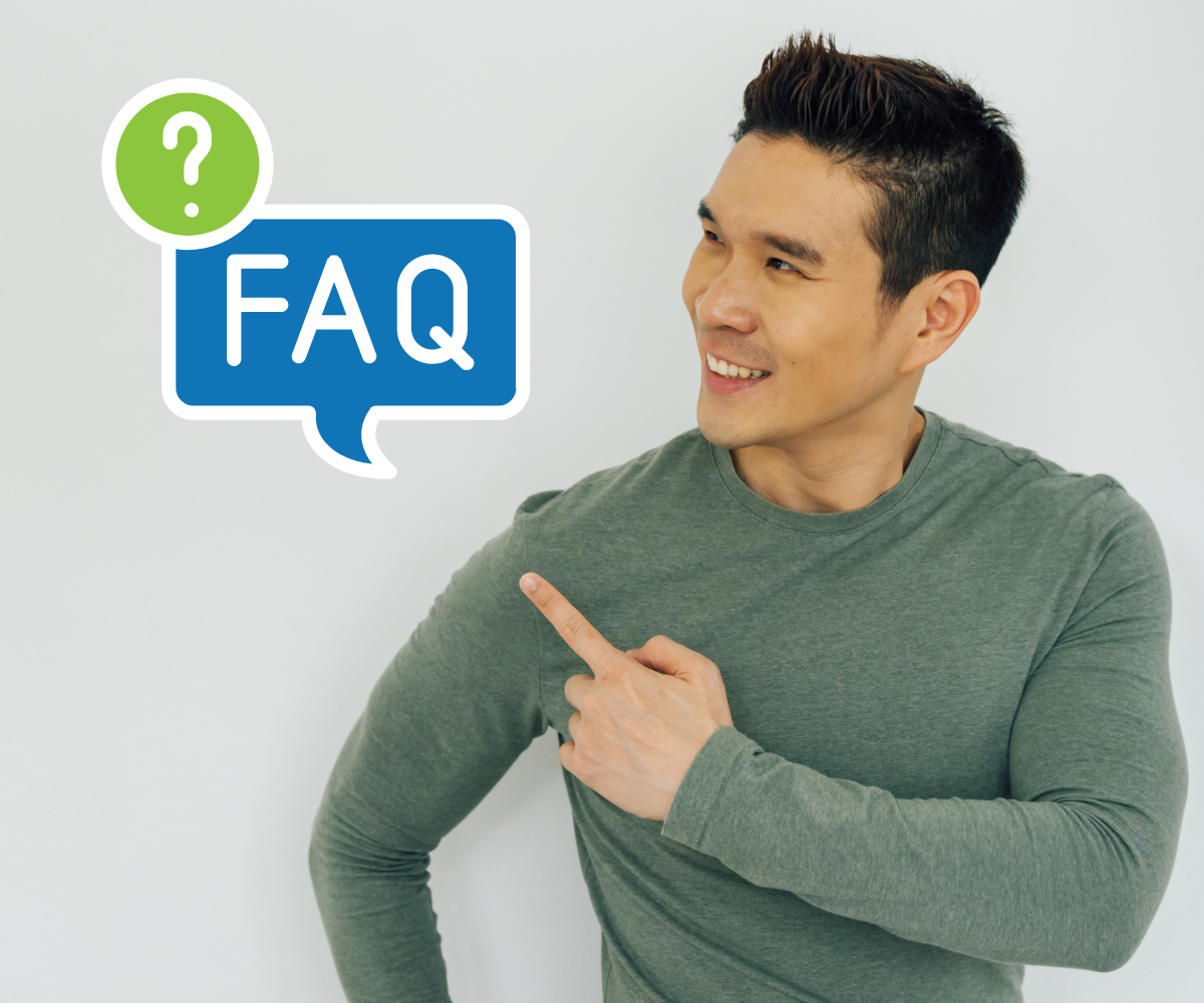 A man in a grey sweater points at a graphic that says Testosterone FAQs