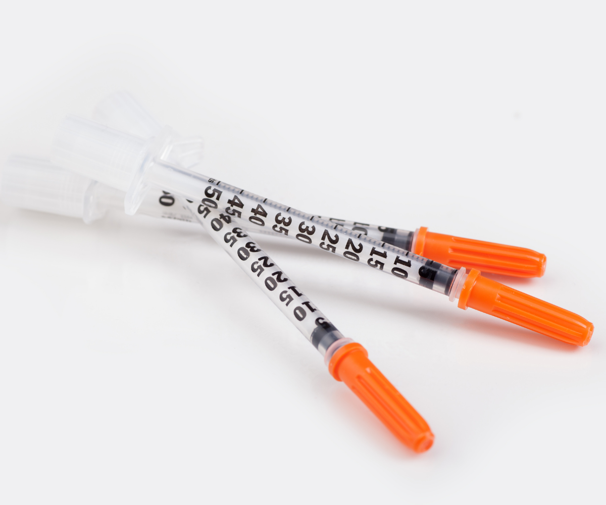 An insulin syringe marked with units.