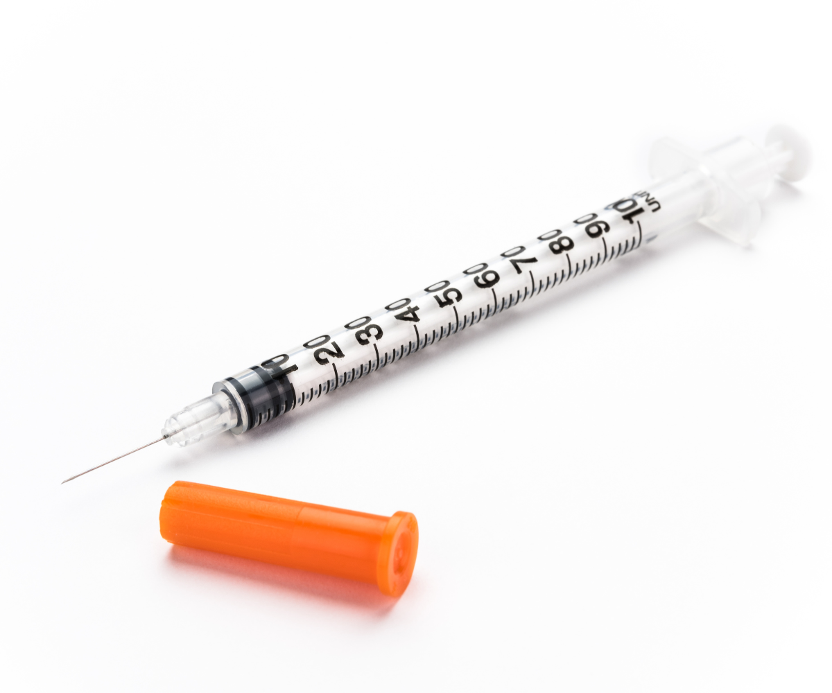 An insulin syringe marked with units as measurement.