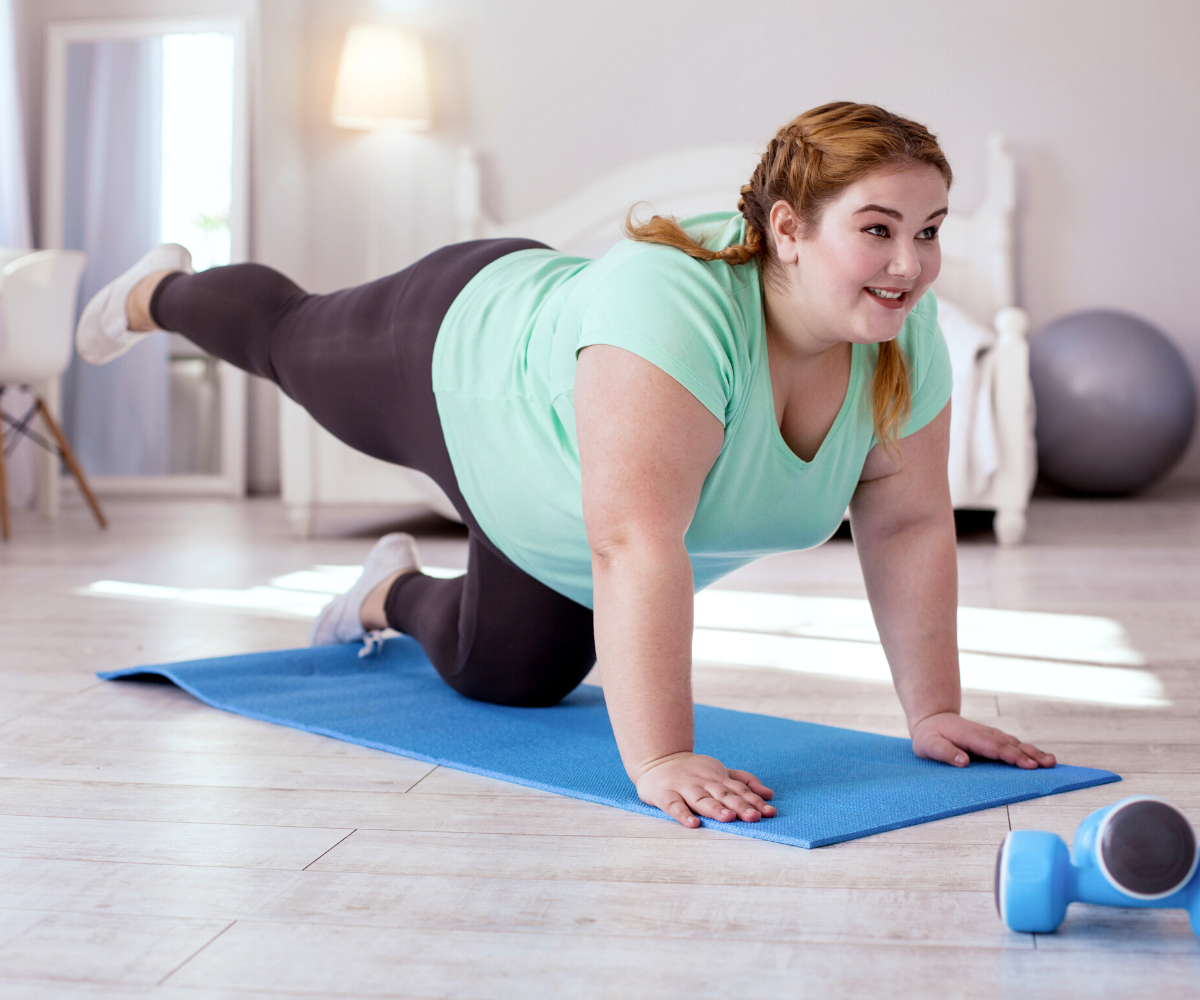 A plus-sized woman exercises as part of her plan to lose weight with Tirzepatide.